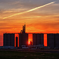 CenDakHenge - sun set between the towers of ND elevator by Peter Herman