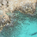 Drone aerial of rocky sea coast with transparent turquoise water. Seascape top view Photograph by Michalakis Ppalis Drone aerial of rocky sea coast with transparent turquoise water. Seascape top view Photograph by Michalakis Ppalis
