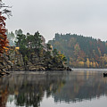 Foggy Landscape With Fishermans Boat On Calm Lake And Autumnal Forest At Lake Ottenstein In Austria Photograph by Andreas Berthold Foggy Landscape With Fishermans Boat On Calm Lake And Autumnal Forest At Lake Ottenstein In Austria Photograph by Andreas Berthold