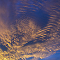 Golden and dark blue cloudscape at sunset Photograph by Adriana Mueller Golden and dark blue cloudscape at sunset Photograph by Adriana Mueller
