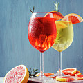 Red and white aperol spritz garnish in wine glasses Photograph by Jelena Jovanovic Red and white aperol spritz garnish in wine glasses Photograph by Jelena Jovanovic