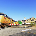 Sign of the Times -- Union Pacific Freight Train at a Railroad Crossing in Caliente, California Photograph by Darin Volpe Sign of the Times -- Union Pacific Freight Train at a Railroad Crossing in Caliente, California Photograph by Darin Volpe