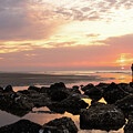 Silhouette of a Woman Walking at Sunrise on Hunting Beach SC by Good Focused