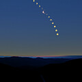 Solar eclipse over Mad River Glen, Vermont by Eric Killorin