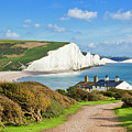 The Seven Sisters cliffs and coastguard cottages, South Downs, East Sussex, England Photograph by Neale And Judith Clark The Seven Sisters cliffs and coastguard cottages, South Downs, East Sussex, England Photograph by Neale And Judith Clark