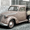 Tiny truck in Roma parked on a cobblestone street, by Stefano Senise