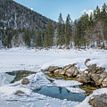 Tree Lined Mountain Lake With Dusting of Snow by Joanne Eastope