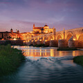 Twilight over Cordoba, The Roman Bridge and Mezquita by John Wright