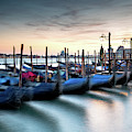 Venice Gondolas moored at the San Marco square. Photograph by Michalakis Ppalis Venice Gondolas moored at the San Marco square. Photograph by Michalakis Ppalis