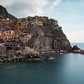 Village of Manarola with colourful houses at the edge of the cliff Riomaggiore, Cinque Terre, Liguria, Italy Photograph by Michalakis Ppalis Village of Manarola with colourful houses at the edge of the cliff Riomaggiore, Cinque Terre, Liguria, Italy Photograph by Michalakis Ppalis