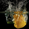 Yellow bell pepper dropped and slashing on water Photograph by Michalakis Ppalis Yellow bell pepper dropped and slashing on water Photograph by Michalakis Ppalis